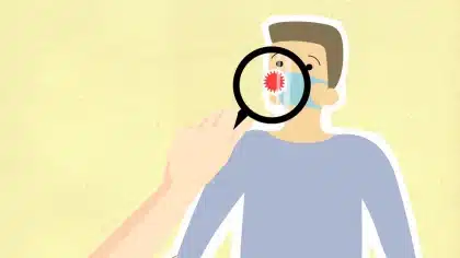 Teléfono móvil mostrando una viñeta satírica rodeada de iconos de reacciones y comentarios en redes sociales